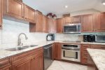 Open, spacious kitchen is well-equipped with everything to prepare any meal.